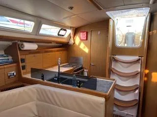 Slide: The Image of Interior of 2010 Jeanneau Sun Odyssey 39i Performance yacht, featuring kitchen and seating area. - 19