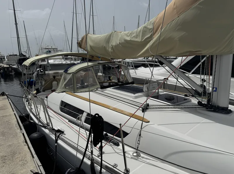 Slide: The Image of 2010 Jeanneau Sun Odyssey 39i Performance sailboat docked at marina. - 2