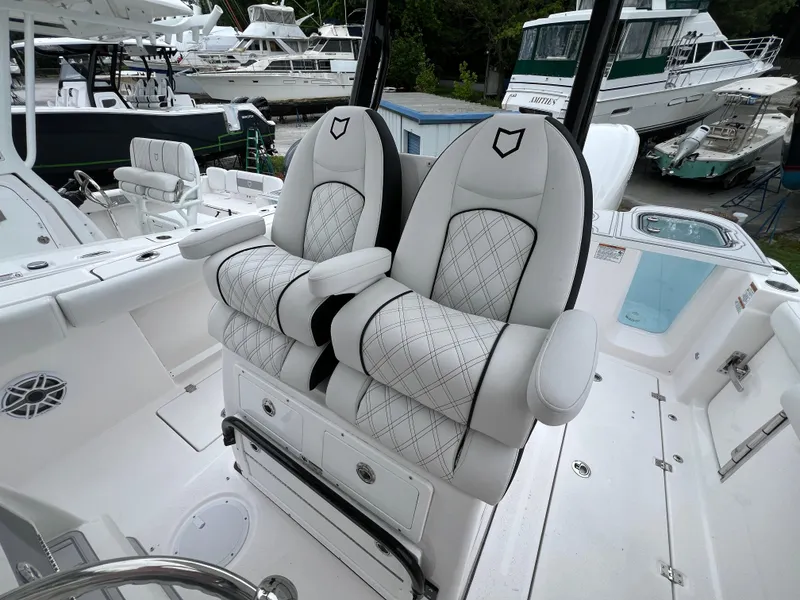 Slide: The Image of Luxury seating on 2025 Sea Fox 288 Commander boat, featuring elegant white upholstery. - 11