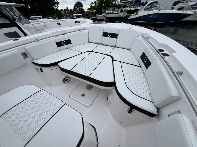 Slide: The Image of 2025 Sea Fox 288 Commander boat with luxurious white seating and diamond stitching. - 3