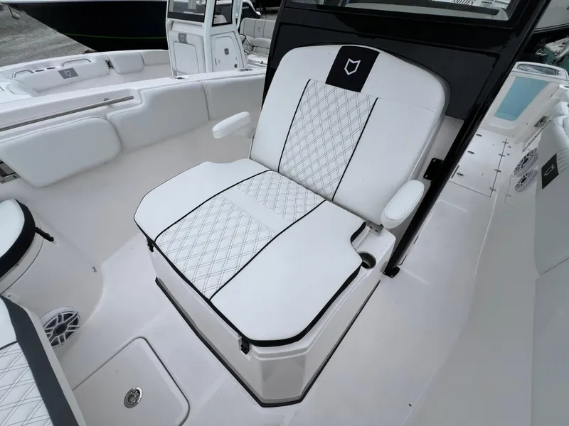Slide: The Image of 2025 Sea Fox 288 Commander boat seat with white upholstery and black accents. - 4