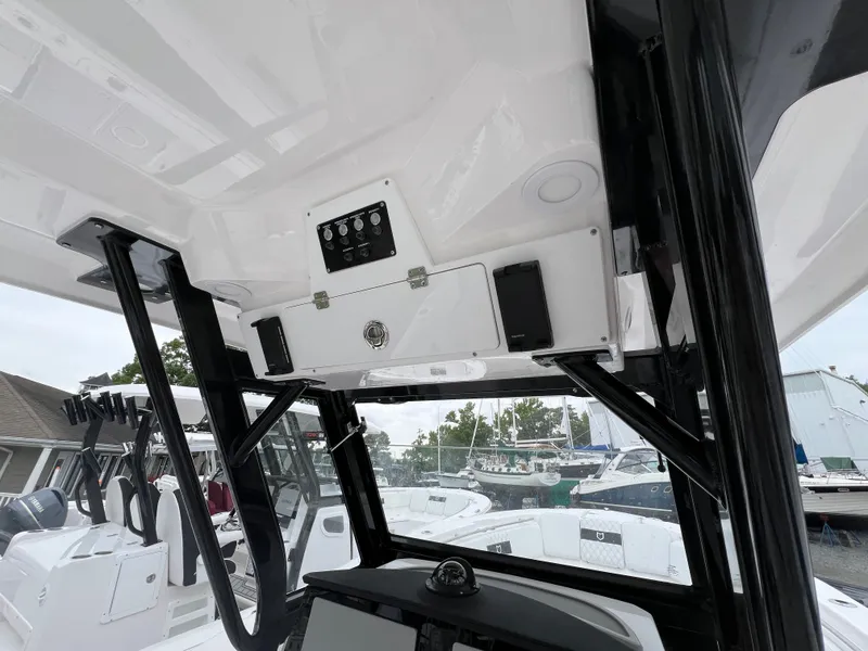 Slide: The Image of 2025 Sea Fox 288 Commander boat interior with control panel and seating. - 10
