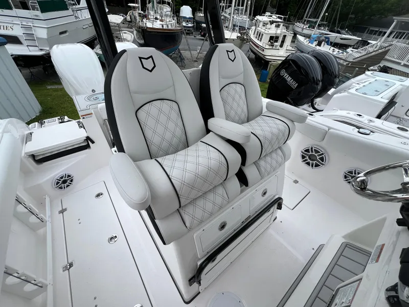 Slide: The Image of 2025 Sea Fox 288 Commander boat with luxurious white seating and Yamaha engine. - 12