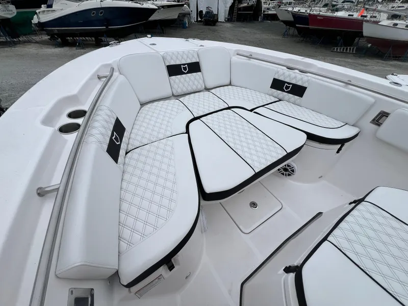 Slide: The Image of 2025 Sea Fox 288 Commander boat with luxurious white seating and black accents. - 2
