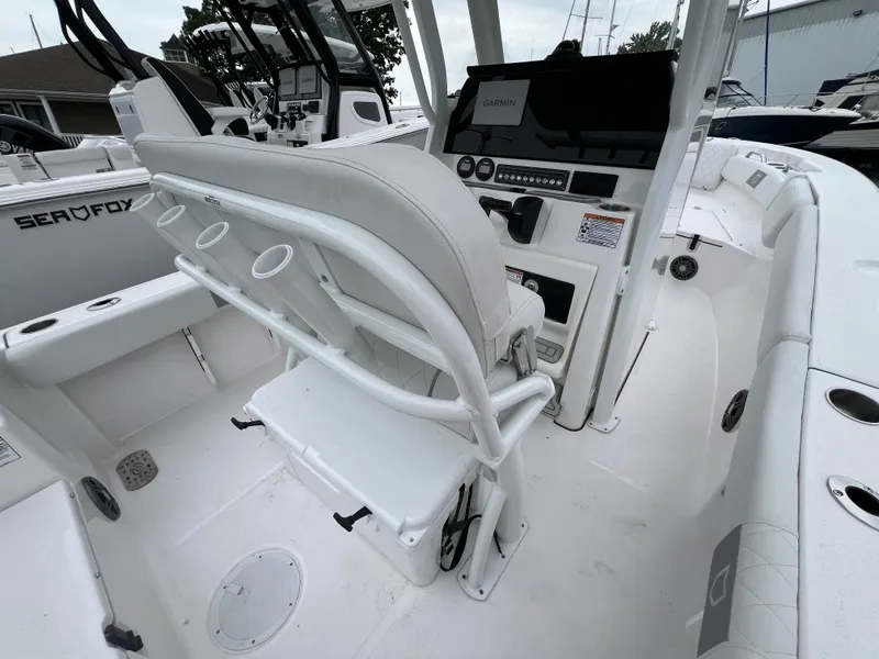 Slide: The Image of 2025 Sea Fox 228 Commander boat interior with helm, seating, and control panel. - 4