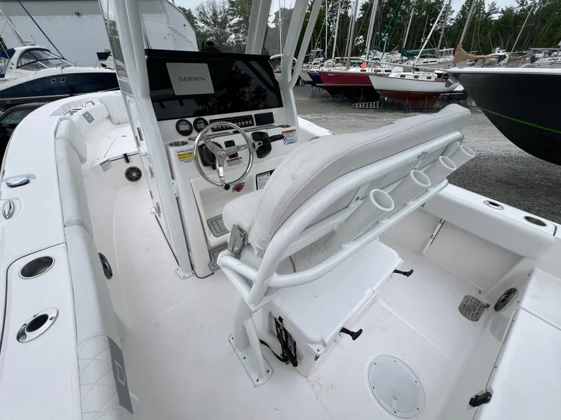 Slide: The Image of 2025 Sea Fox 228 Commander boat interior with helm, seating, and navigation equipment. - 5