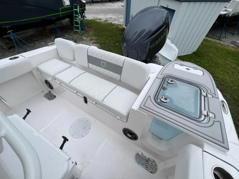 Slide: The Image of 2025 Sea Fox 228 Commander boat interior with seating and storage compartments. - 7