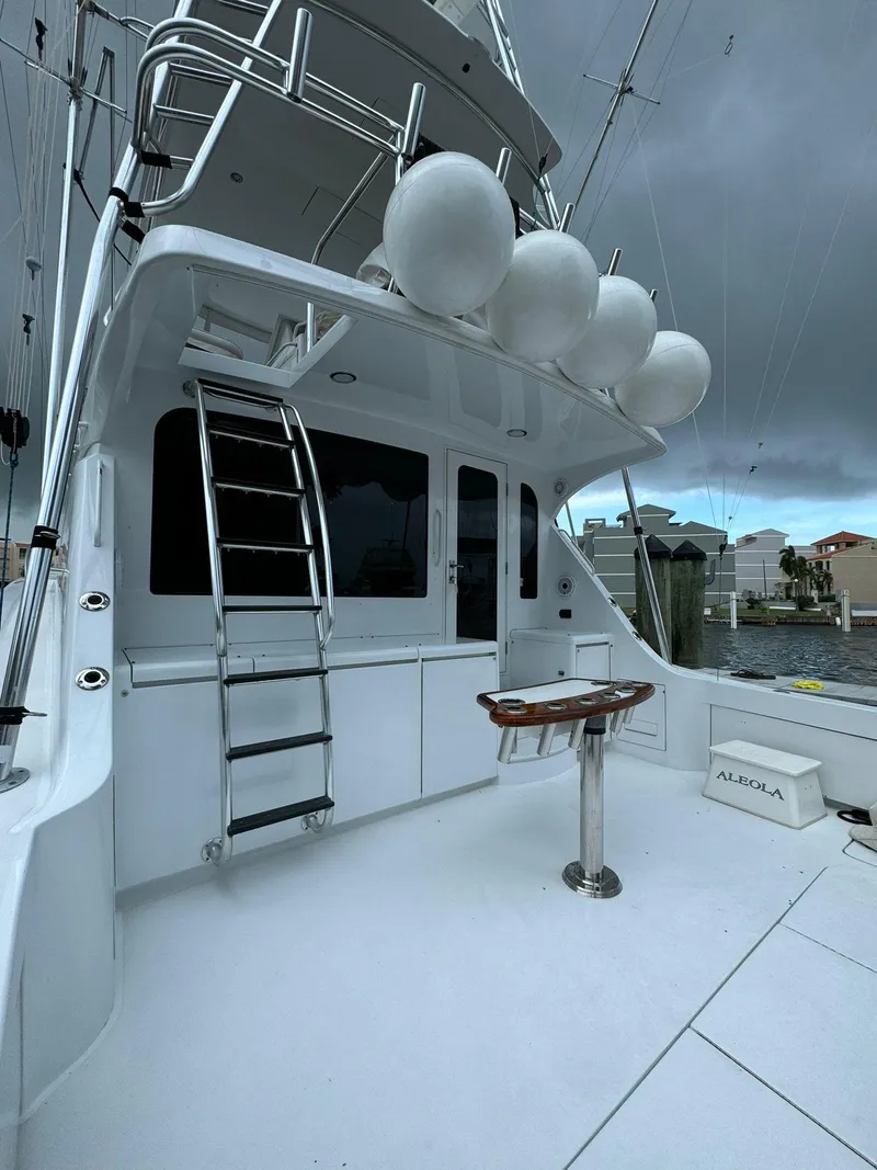 Slide: The Image of 2006 Hatteras 54 Convertible yacht with sleek design and spacious deck. - 4