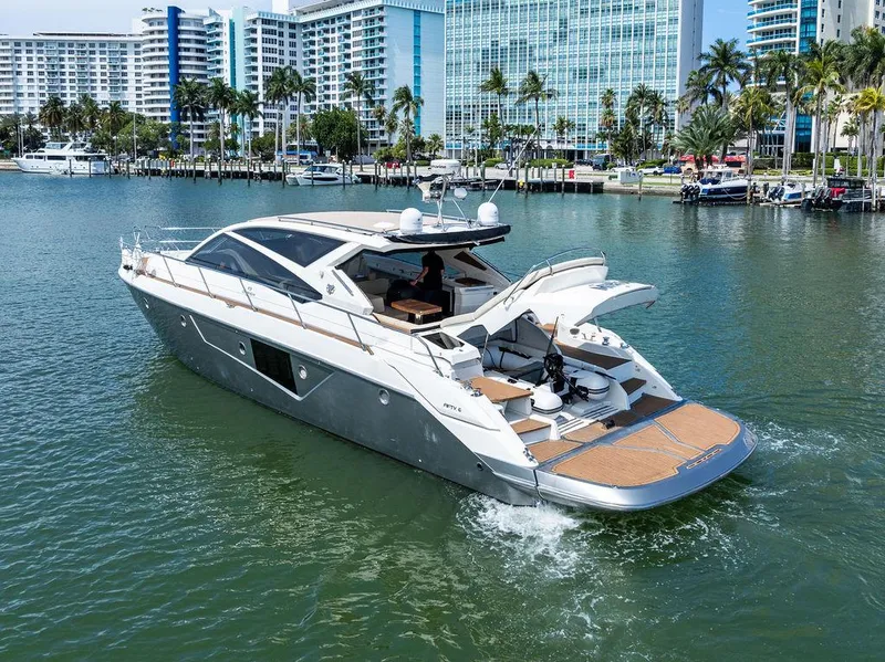 Slide: The Image of Luxury 2014 Cranchi 56 HT yacht cruising in a scenic waterfront setting. - 12