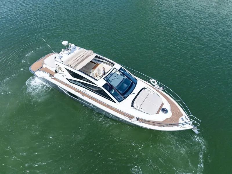 Slide: The Image of Luxury 2014 Cranchi 56 HT yacht cruising on open water. - 14