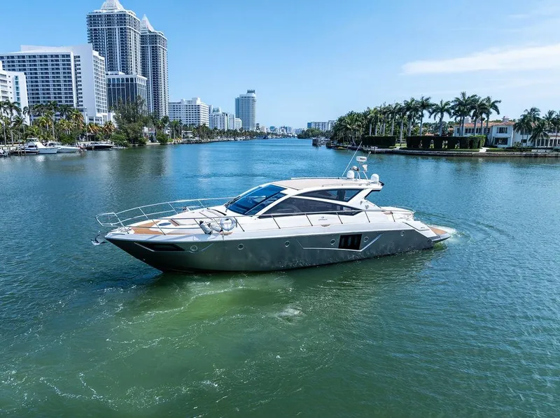 Slide: The Image of Luxury 2014 Cranchi 56 HT yacht cruising in a scenic urban waterway. - 2