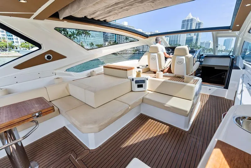 Slide: The Image of Luxurious 2014 Cranchi 56 HT yacht interior with plush seating and modern design. - 23