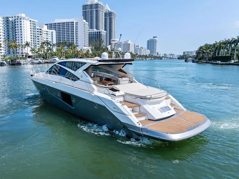 Slide: The Image of Luxury 2014 Cranchi 56 HT yacht cruising in a scenic urban waterway. - 4