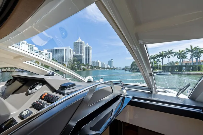 Slide: The Image of Interior view from 2014 Cranchi 56 HT yacht, overlooking a city skyline and waterway. - 41