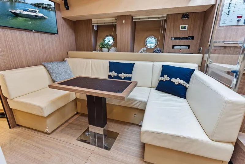 Slide: The Image of Luxurious interior of 2014 Cranchi 56 HT yacht with elegant seating and table. - 43
