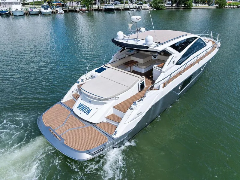 Slide: The Image of Luxury 2014 Cranchi 56 HT yacht cruising on a serene lake. - 5