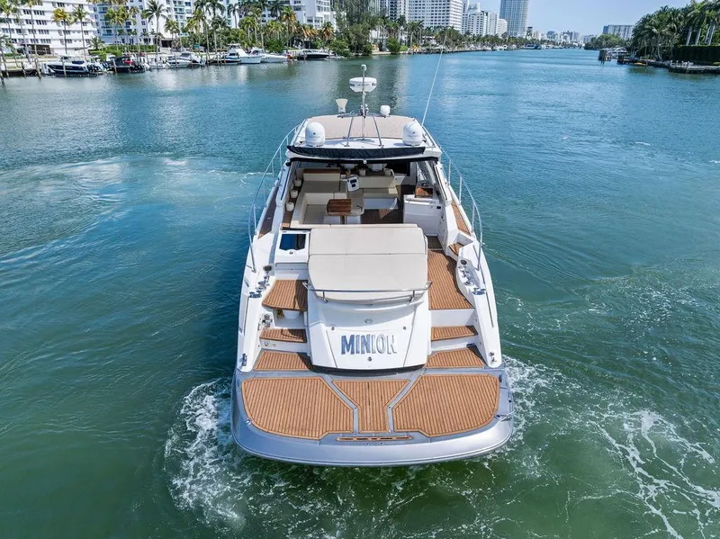 Slide: The Image of 2014 Cranchi 56 HT yacht cruising on a scenic waterway. - 9