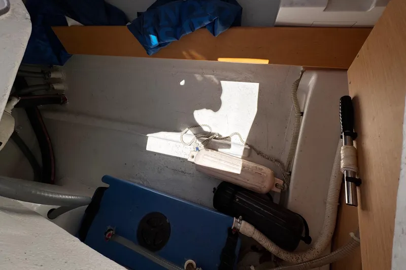 Slide: The Image of Interior view of a 2014 Beneteau FIRST 25 S sailboat showing storage and equipment. - 20