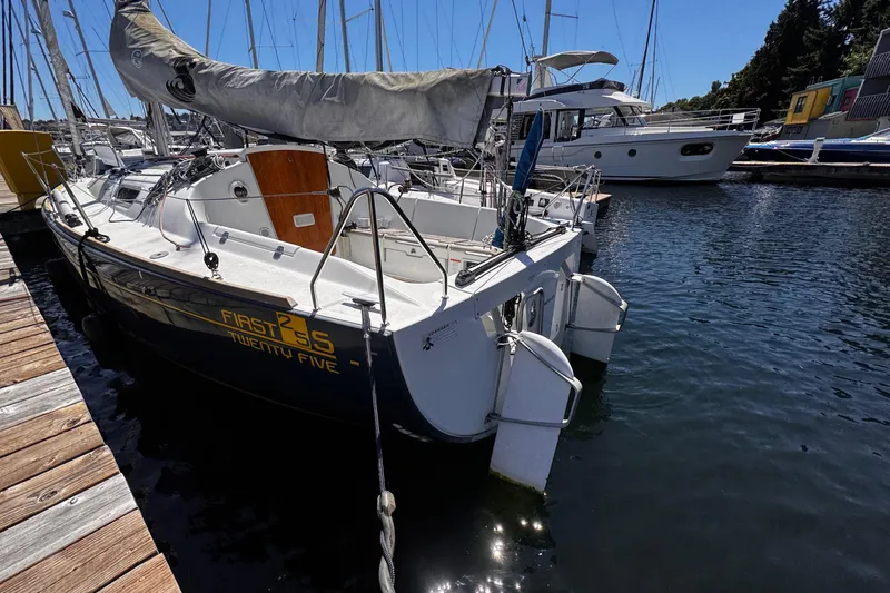 Slide: The Image of 2014 Beneteau FIRST 25 S sailboat docked in marina, side view. - 21