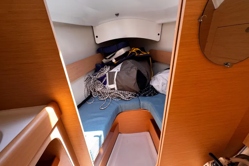 Slide: The Image of Cozy cabin interior of 2014 Beneteau FIRST 25 S sailboat with storage and ropes. - 30
