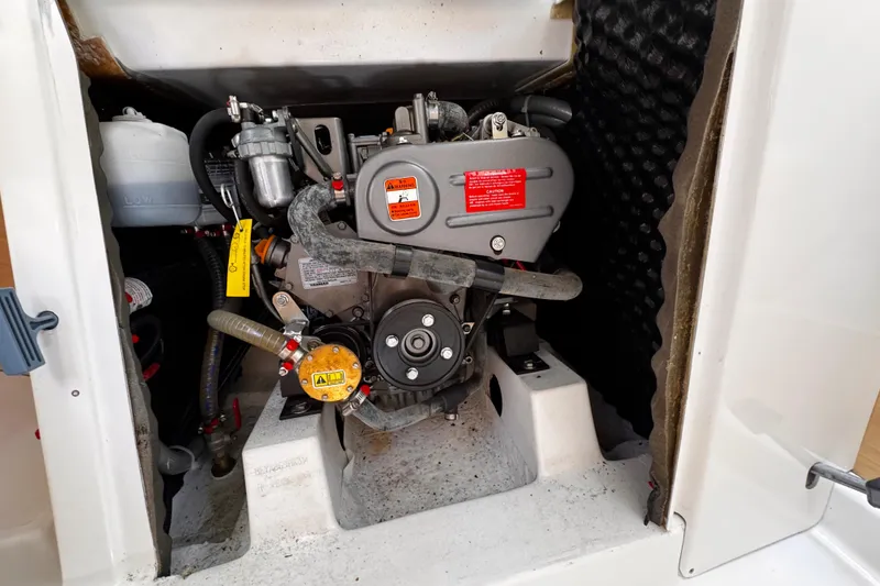 Slide: The Image of Engine compartment of a 2014 Beneteau FIRST 25 S sailboat, showcasing mechanical components. - 35