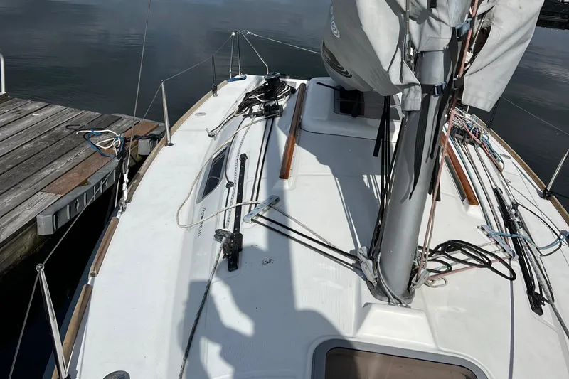 Slide: The Image of Beneteau FIRST 25 S sailboat deck, 2014 model, docked at a wooden pier. - 5