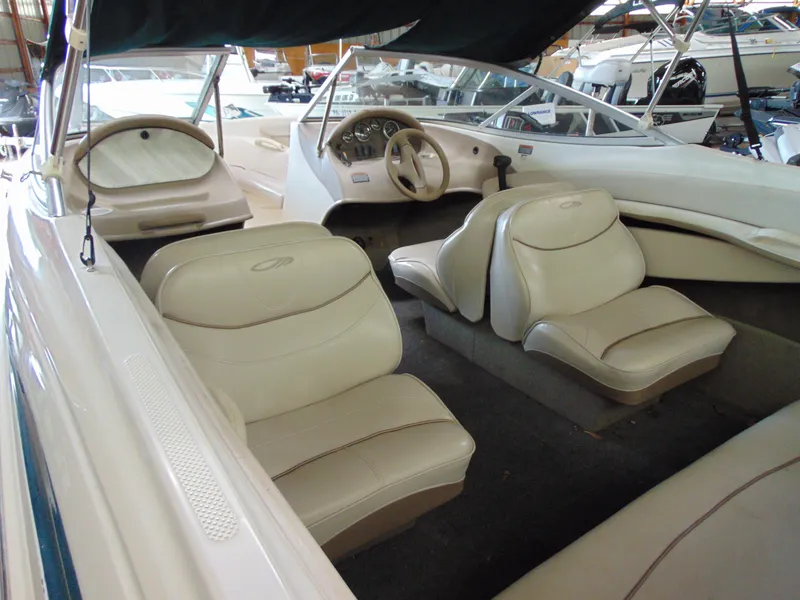 Slide: The Image of Interior of a 1999 Maxum 1800 XR boat with beige seats. - 5