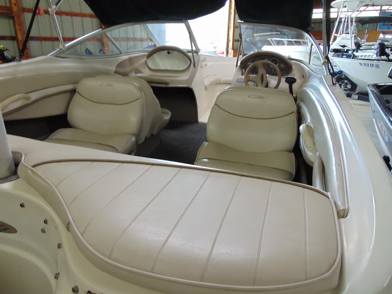 Slide: The Image of Interior of a 1999 Maxum 1800 XR boat with beige seats. - 9