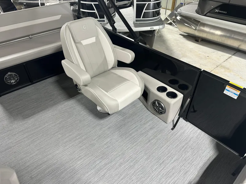 Slide: The Image of Luxurious 2025 Godfrey Xperience Lounge boat interior with plush seating and cup holders. - 13
