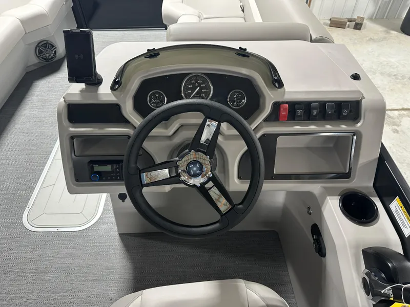 Slide: The Image of Steering console of 2025 Godfrey Xperience Lounge boat with modern controls and gauges. - 15