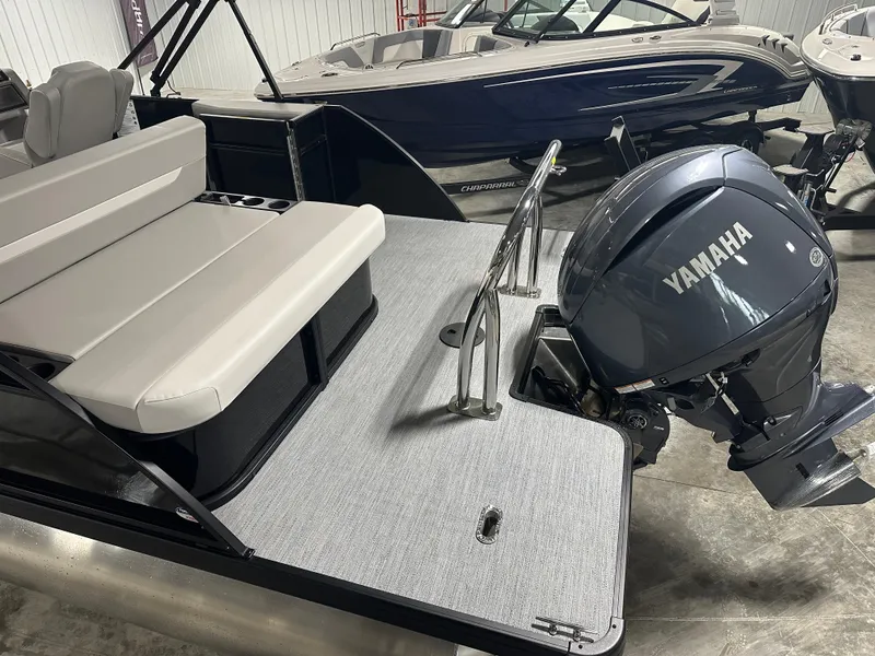 Slide: The Image of 2025 Godfrey Xperience Lounge boat with Yamaha outboard motor in showroom. - 5