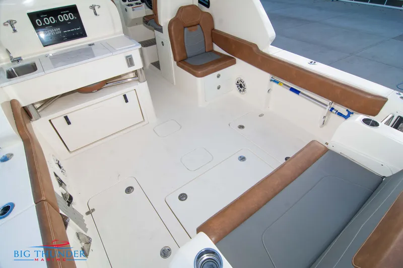 Slide: The Image of 2022 Scout 350 LXZ boat interior with seating and storage compartments. - 16