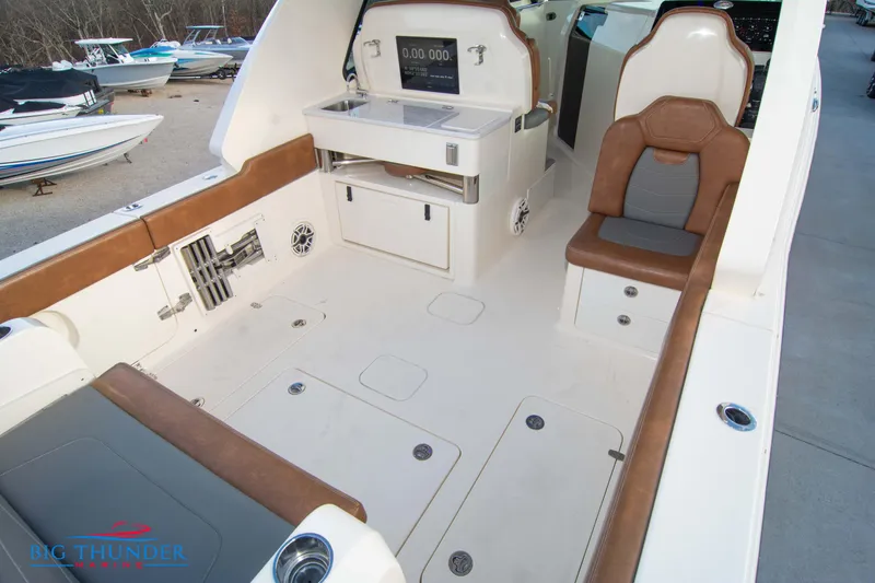 Slide: The Image of 2022 Scout 350 LXZ boat interior with seating and storage compartments. - 17