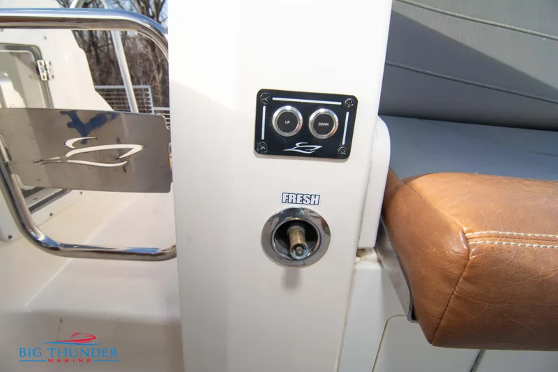 Slide: The Image of 2022 Scout 350 LXZ boat interior with fresh water outlet and control panel. - 21