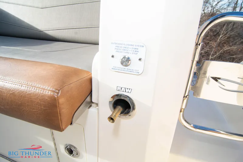 Slide: The Image of 2022 Scout 350 LXZ boat interior with seating and raw water outlet. - 22