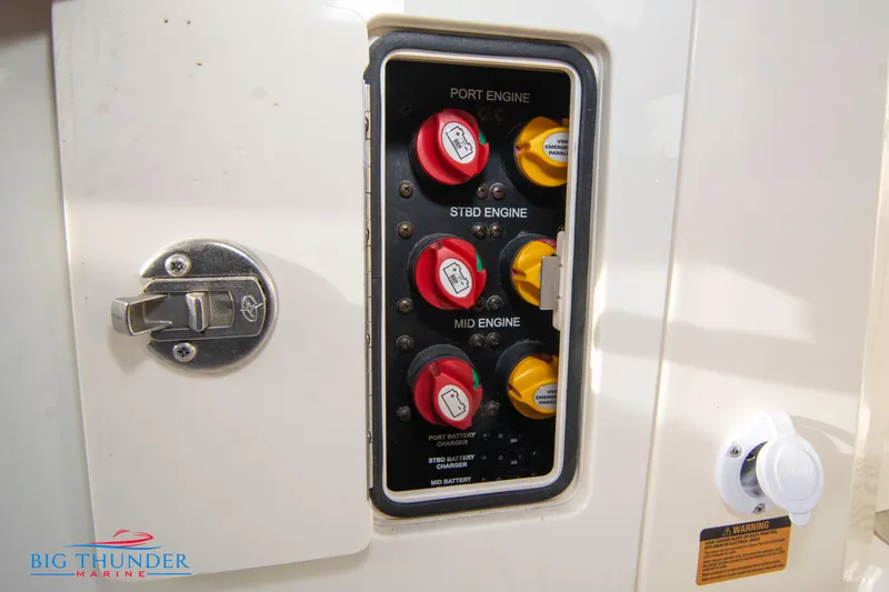 Slide: The Image of Control panel of a 2022 Scout 350 LXZ boat with labeled engine switches. - 24