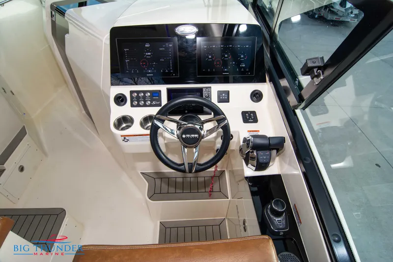Slide: The Image of 2022 Scout 350 LXZ boat cockpit with modern steering and control panels. - 43