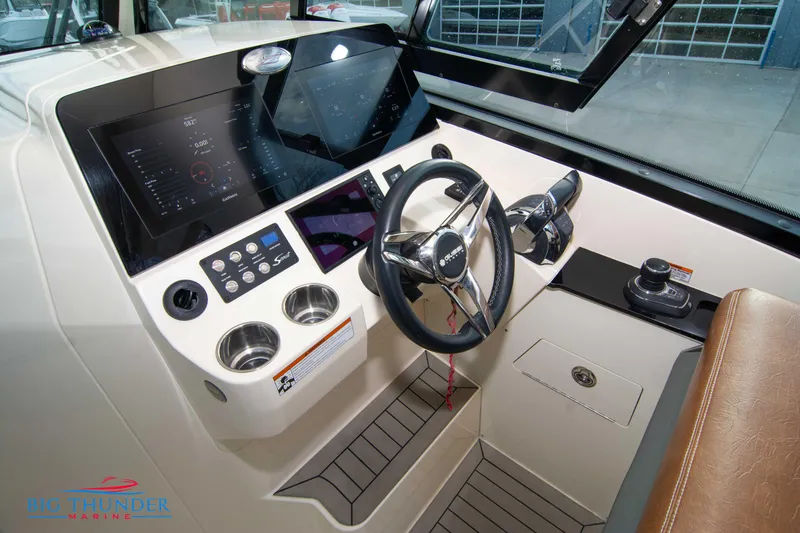 Slide: The Image of 2022 Scout 350 LXZ boat cockpit with modern controls and steering wheel. - 44