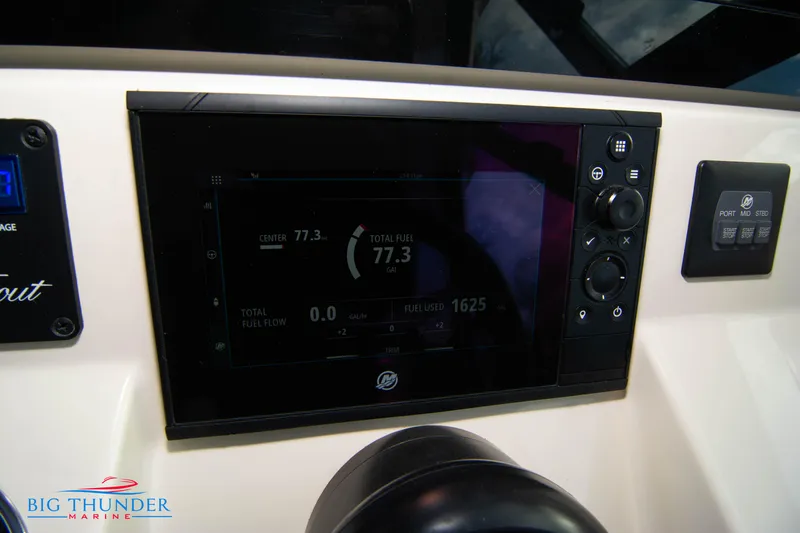 Slide: The Image of 2022 Scout 350 LXZ dashboard display with navigation controls and fuel data. - 48