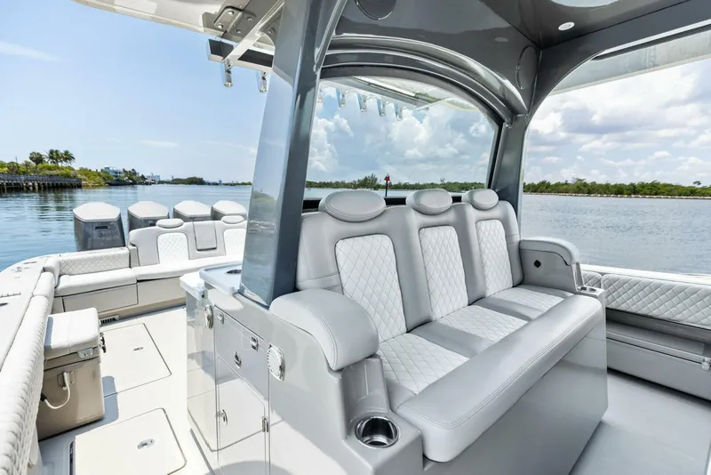 Slide: The Image of Luxurious seating on the 2023 HCB 53 Sueños boat, featuring elegant design and waterfront views. - 18