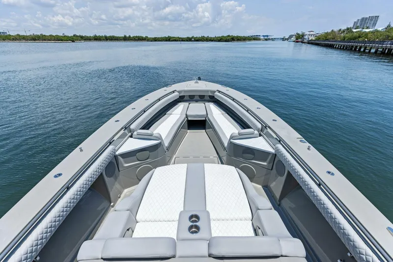 Slide: The Image of 2023 HCB 53 Sueños luxury boat interior with plush seating on calm water. - 19