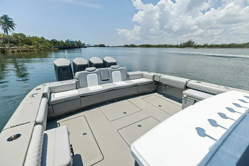 Slide: The Image of 2023 HCB 53 Sueños boat with spacious seating on calm water. - 22