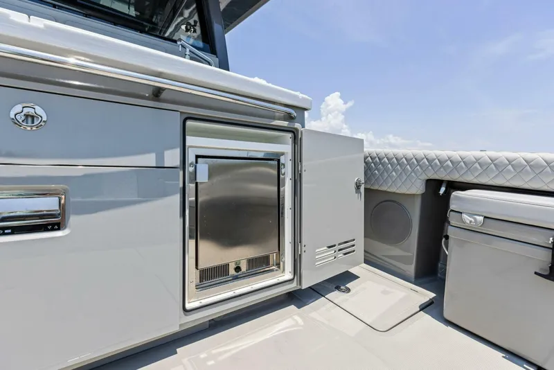 Slide: The Image of 2023 HCB 53 Sueños yacht interior with stainless steel appliances and luxurious seating. - 27