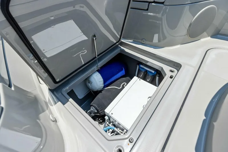 Slide: The Image of Storage compartment of 2023 HCB 53 Sueños boat, featuring equipment and accessories. - 28