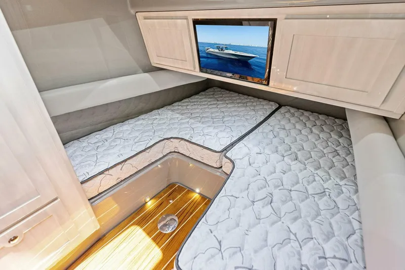 Slide: The Image of Luxurious cabin interior of 2023 HCB 53 Sueños with cozy bedding and mounted TV. - 31