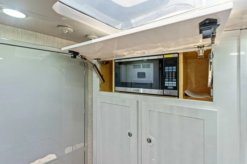 Slide: The Image of Modern kitchen area in 2023 HCB 53 Sueños boat with built-in microwave. - 34