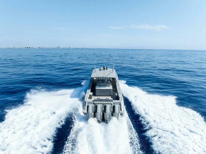 Slide: The Image of HCB 53 Sueños 2023 boat cruising on open sea with powerful engines. - 36