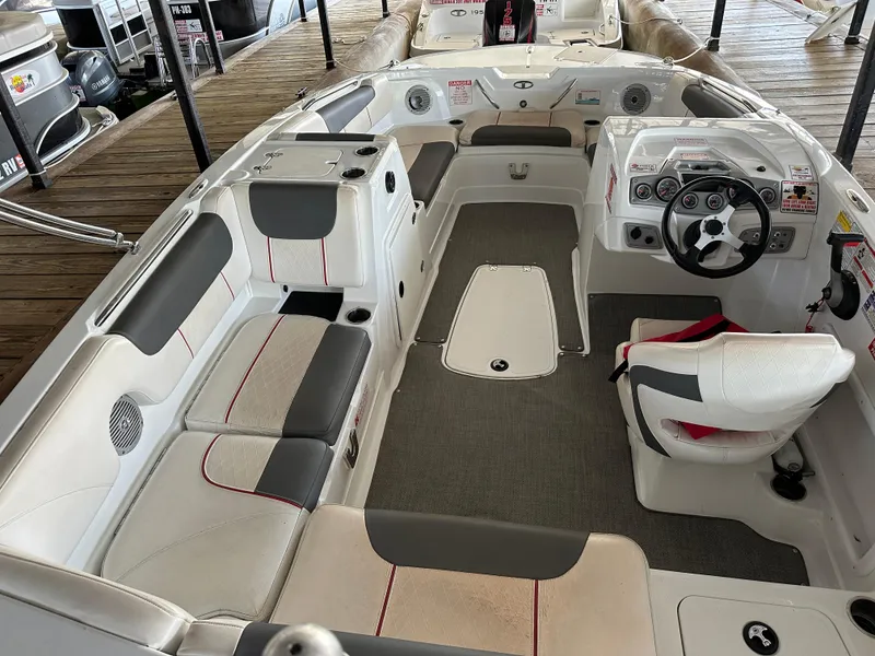 Slide: The Image of Interior of a 2021 Tahoe 1950 boat with seating and steering wheel. - 4