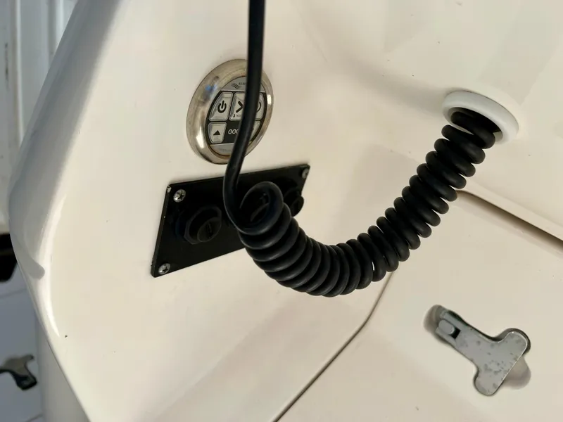 Slide: The Image of 2015 Intrepid 375 Center Console dashboard with coiled cable and control panel. - 13