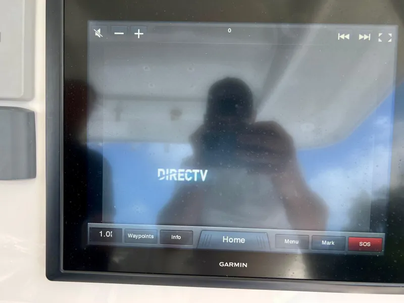 Slide: The Image of Garmin display on 2015 Intrepid 375 Center Console showing DirecTV interface. - 16